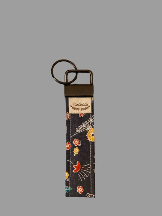 Hand-Sewn Folk Floral Keyfob – Whimsical Blooms on Dark Grey